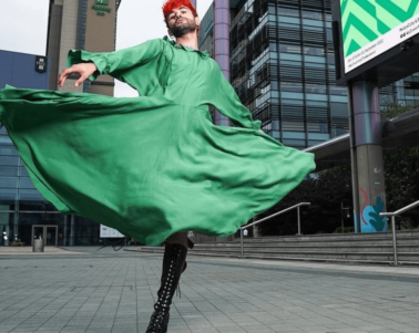 person standing in front of the Plaza spinning