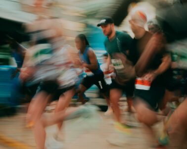 a blurry image of runners crossing the finish line