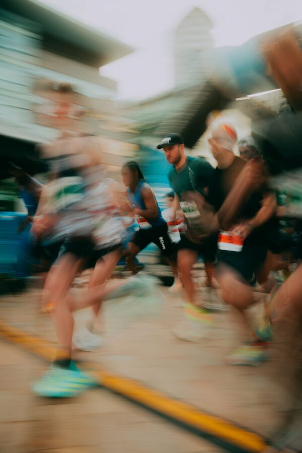 a blurry image of runners crossing the finish line